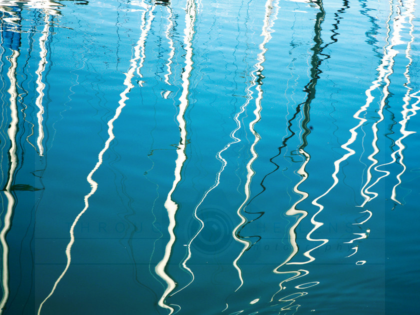 Marina reflections 4 
 Reflections of yacht masts in Evian marina 
 Keywords: reflections, water, marina, yacht, boat, masts, abstract, pattern, Evian, Lake Geneva, harbour, blue, black, white