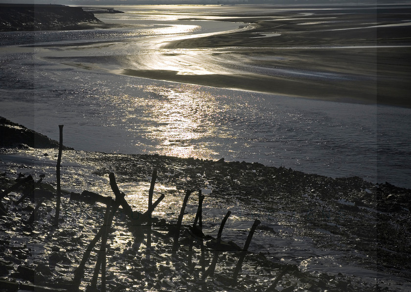 Severn Estuary Sunrise 
 Keywords: River, gloucestershire, Monmouthshire, Severn, monochrome, estuary, posts, tide, shingle,sunlight, shadow, morning, sunrise, reflection,swirls,water